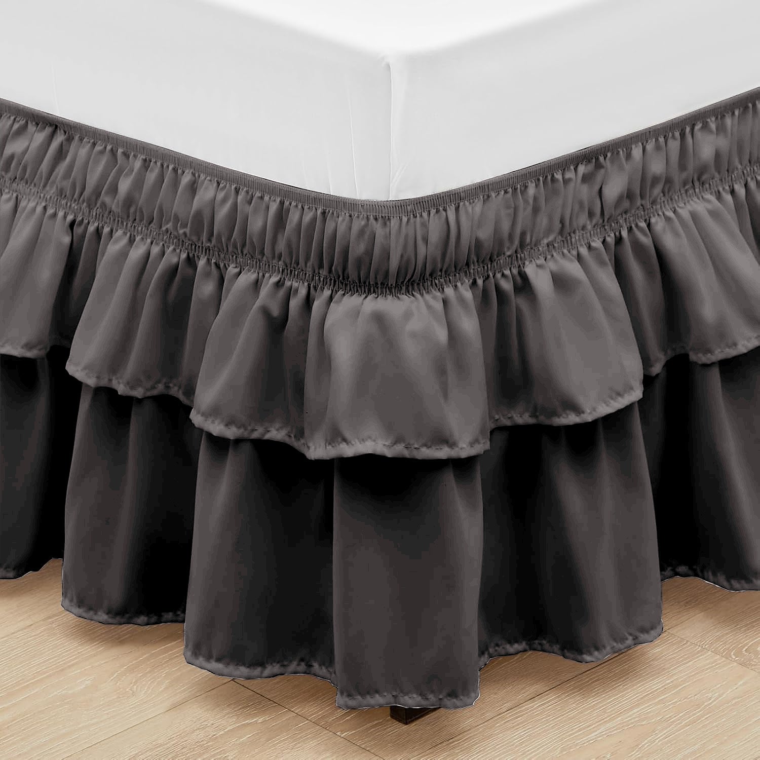 Wrap around elastic bed skirt with modern dust ruffle design for multiple bed sizes