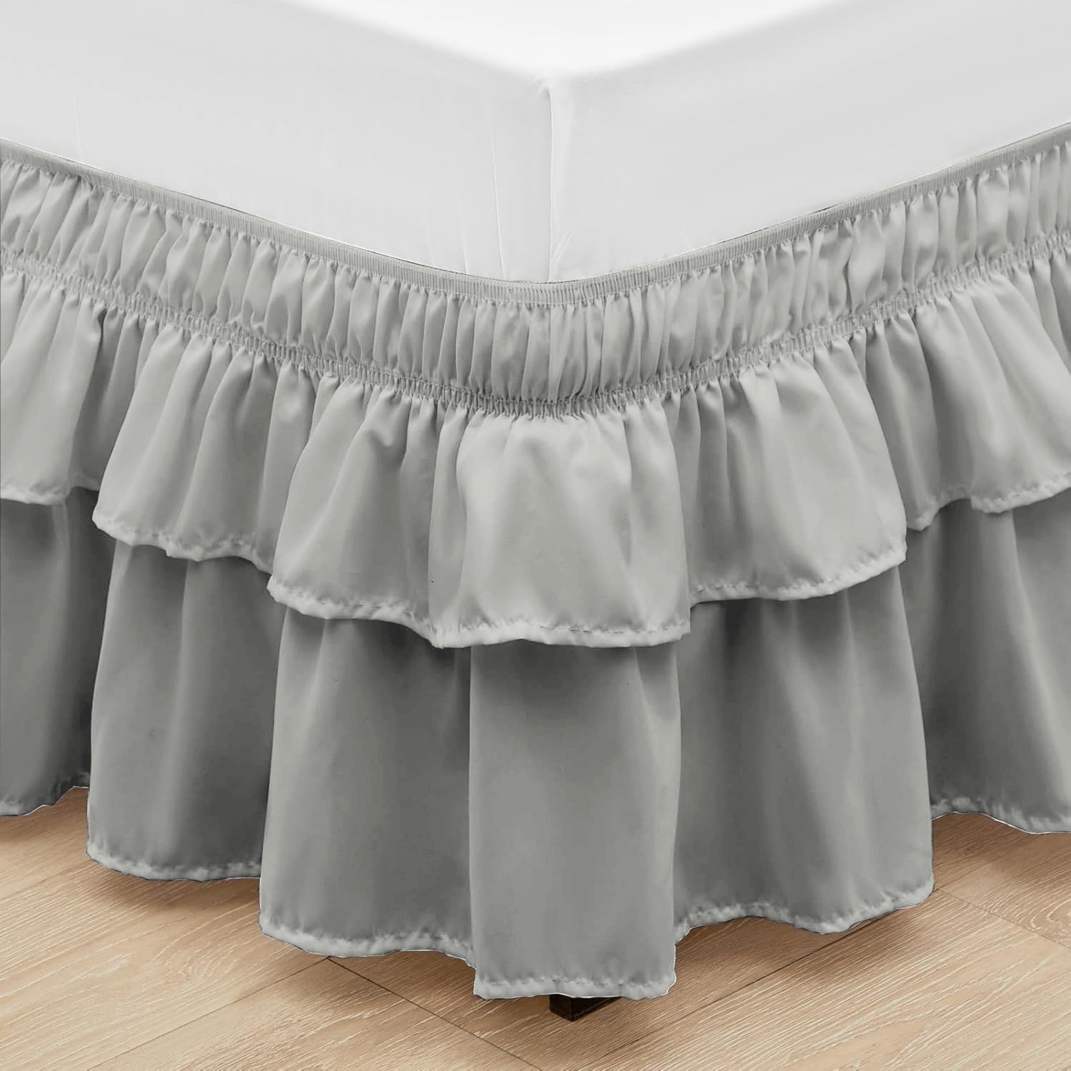Wrap around elastic bed skirt with modern dust ruffle design for multiple bed sizes