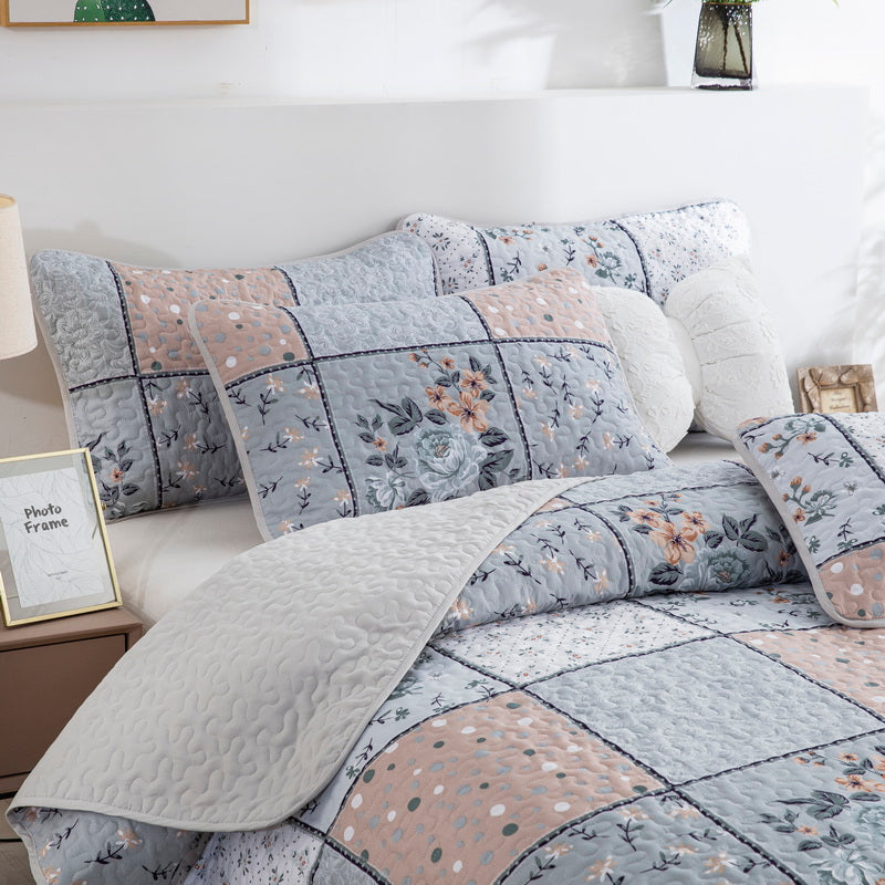 Boho style quilt bedspread set with pastel botanical prints and four pillow shams