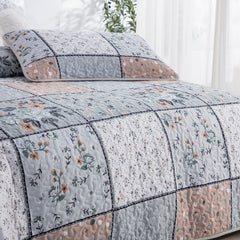 Boho style quilt bedspread set with pastel botanical prints and four pillow shams