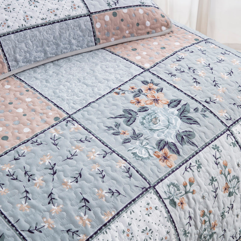 Boho style quilt bedspread set with pastel botanical prints and four pillow shams