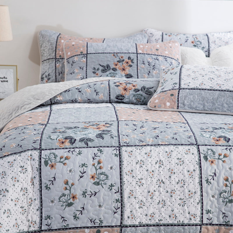 Boho style quilt bedspread set with pastel botanical prints and four pillow shams