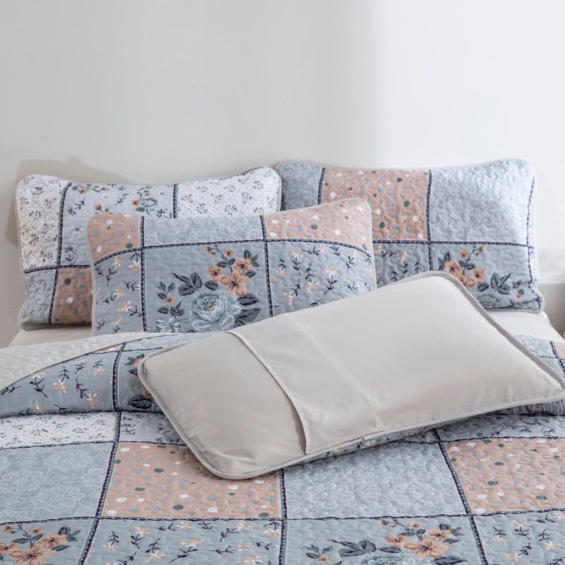 Boho style quilt bedspread set with pastel botanical prints and four pillow shams