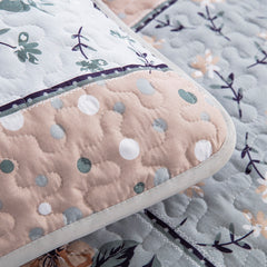 Boho style quilt bedspread set with pastel botanical prints and four pillow shams