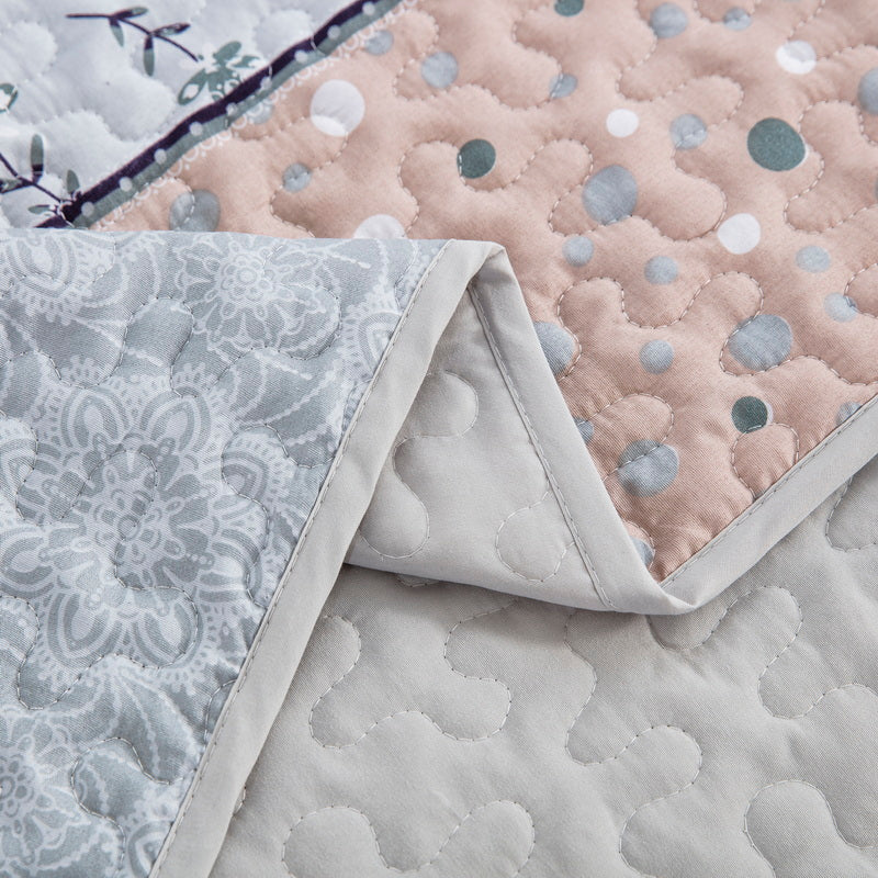 Boho style quilt bedspread set with pastel botanical prints and four pillow shams