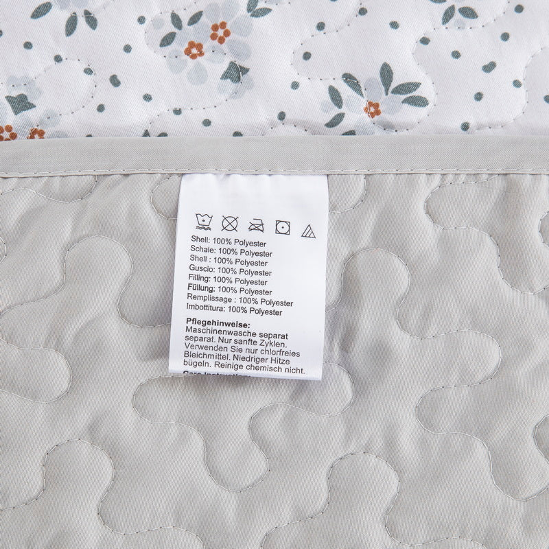 Boho style quilt bedspread set with pastel botanical prints and four pillow shams